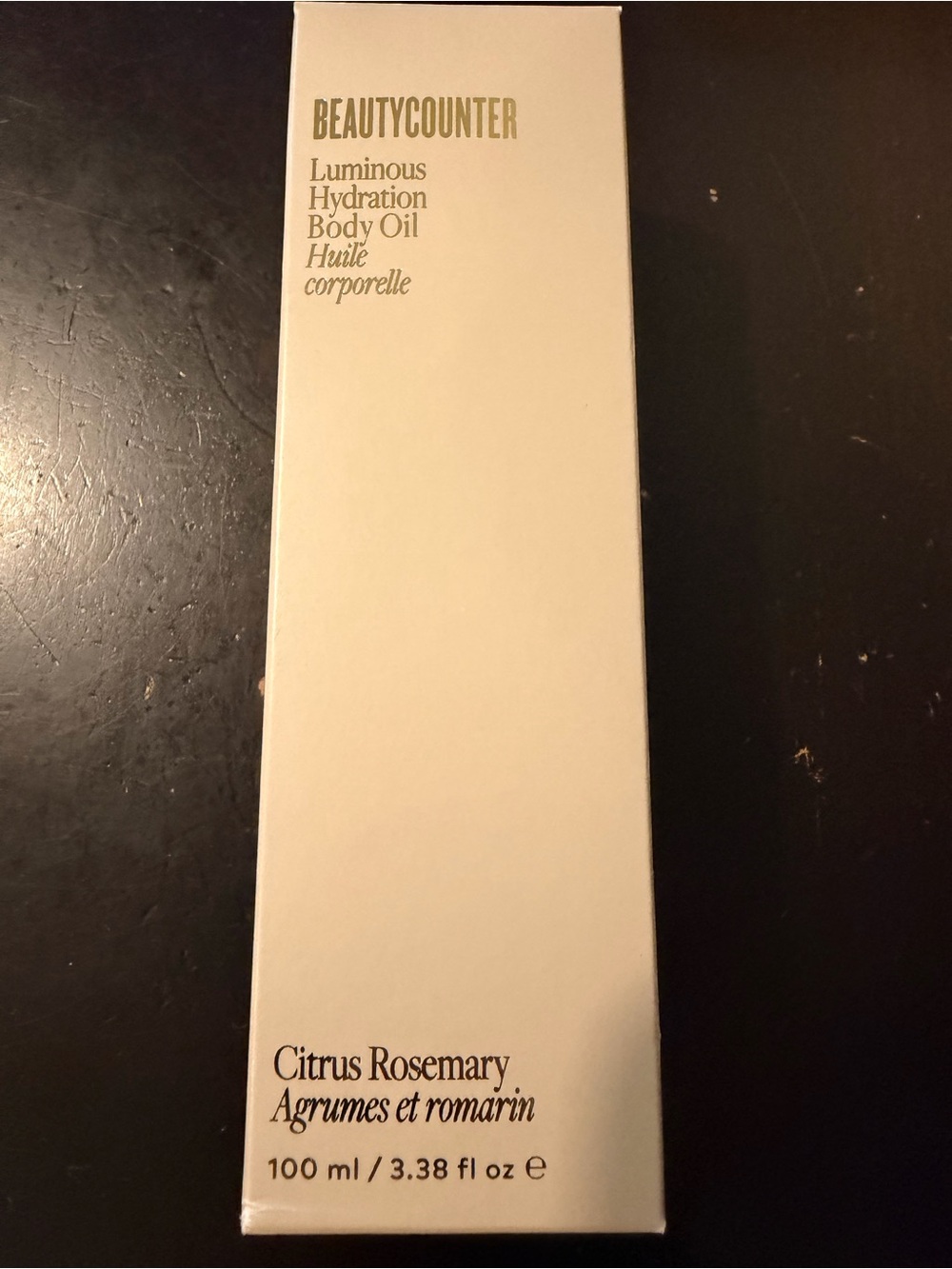 beautycounter Luminous Hydration Body Oil - Cream and Black Text
